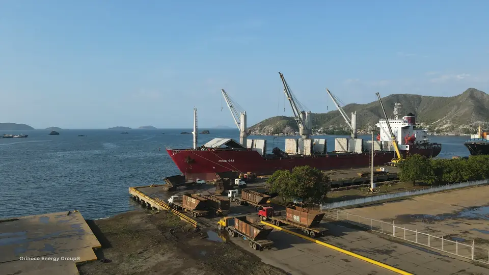 Cargo vessel, industrial cargo and handling equipment alongside the quay