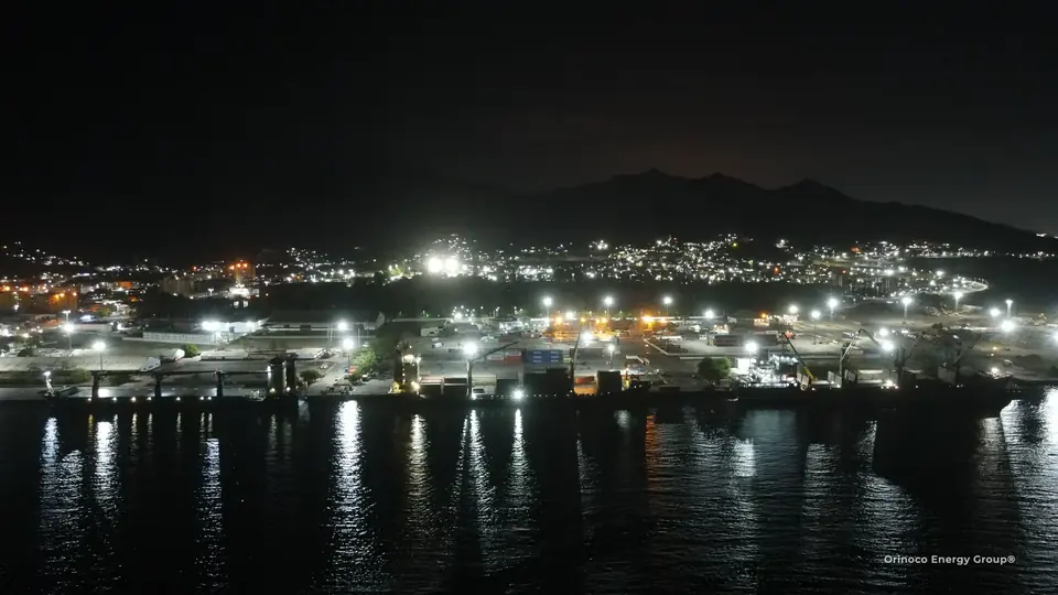 Port and vessel lights reflected in the bay after dark