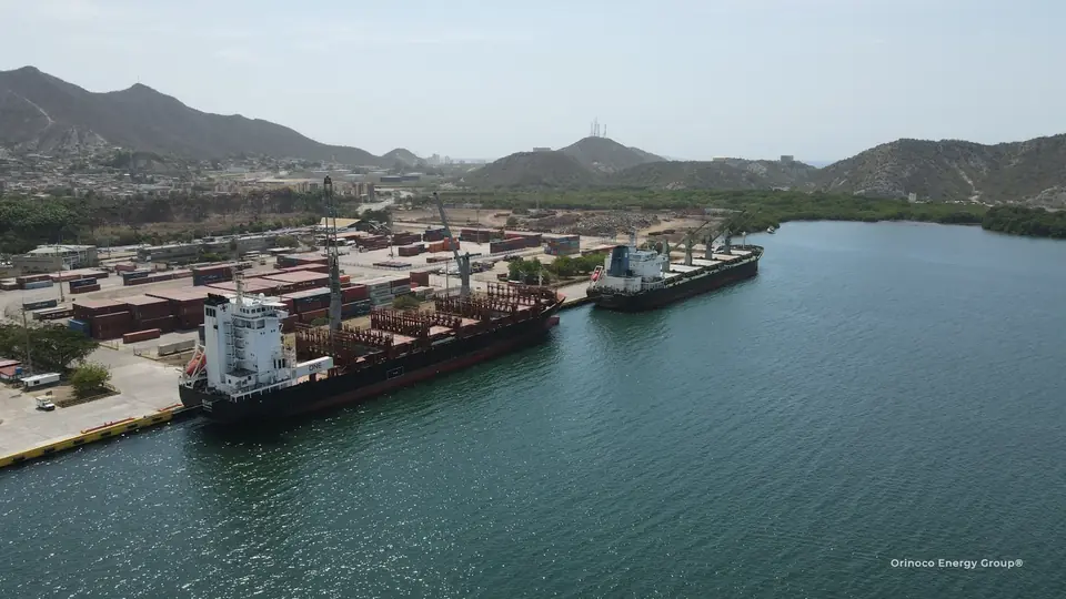 Cargo vessel and quayside viewed across the bay