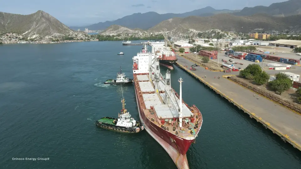 Vessel and tugboats alongside the quay