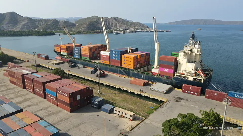 Container vessel with yard operations in the foreground